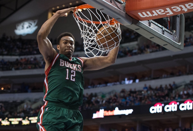 Dec 7, 2014; Dallas, TX, USA; Milwaukee Bucks forward Jabari Parker (12) dunks the ball during the second half against the Dallas Mavericks at the American Airlines Center. The Mavericks defeated the Bucks 125-102. Mandatory Credit: Jerome Miron-USA TODAY Sports