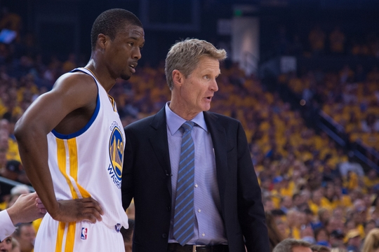 April 18, 2015; Oakland, CA, USA; Golden State Warriors forward Harrison Barnes (40) and head coach Steve Kerr (right) talk during the first quarter in game one of the first round of the NBA Playoffs against the New Orleans Pelicans at Oracle Arena. The Warriors defeated the Pelicans 106-99. Mandatory Credit: Kyle Terada-USA TODAY Sports