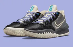 Une Kyrie 4 Low en noir et blanc cassé