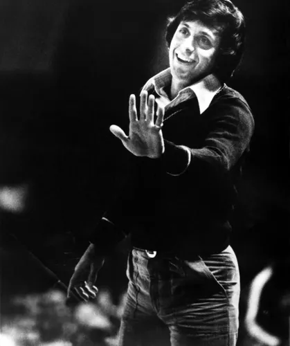 Larry Brown talks with his team