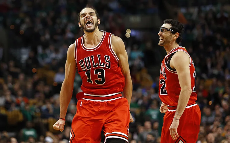 Nov 28, 2014; Boston, MA, USA; Chicago Bulls center Joakim Noah (13) and Chicago Bulls guard Kirk Hinrich (12) celebrate Noah's basket in the final minute of the Chicago Bulls 109-102 win over the Boston Celtics at TD Garden. Mandatory Credit: Winslow Townson-USA TODAY Sports