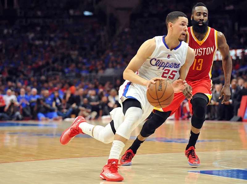 May 8, 2015; Los Angeles, CA, USA; Los Angeles Clippers  guard Austin Rivers (25) moves the ball ahead of Houston Rockets guard James Harden (13) during the second half in game three of the second round of the NBA Playoffs. at Staples Center. Mandatory Credit: Gary A. Vasquez-USA TODAY Sports