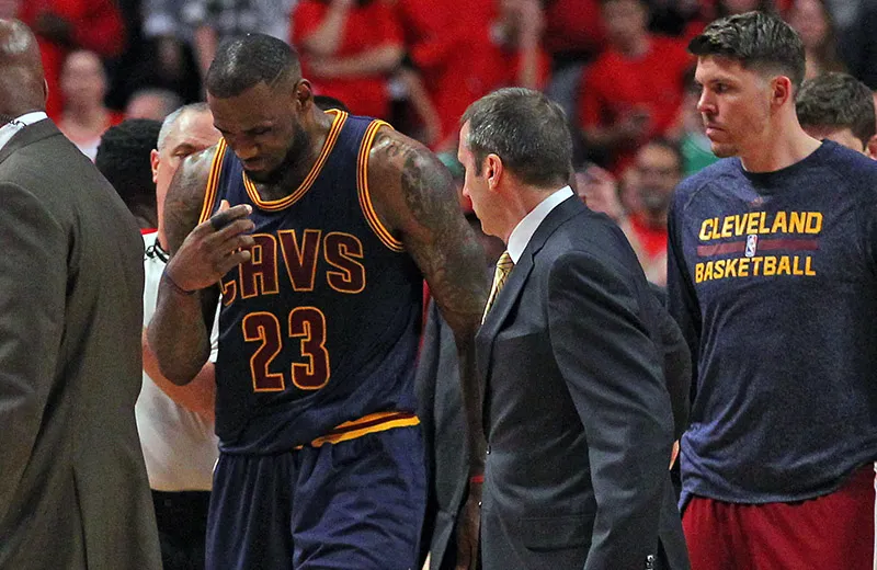 May 10, 2015; Chicago, IL, USA; Cleveland Cavaliers forward LeBron James (23) talks with head coach David Blatt after appearing to be injured in the second half of game four of the second round of the NBA Playoffs against the Chicago Bulls at the United Center. Cleveland won 86-84. Mandatory Credit: Dennis Wierzbicki-USA TODAY Sports
