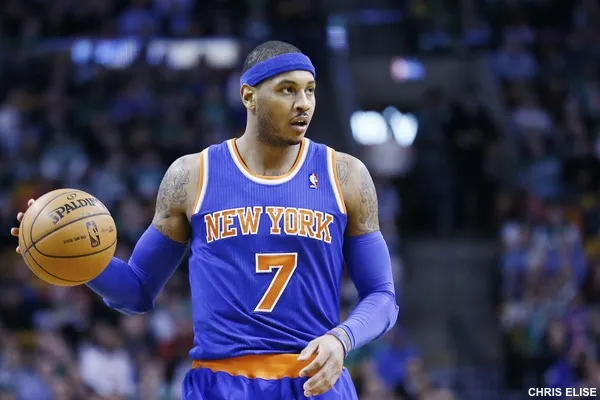 If you’re looking for Carmelo Anthony to be a vocal leader this season, you might have misguided expectations. “I lead in my own way,” Anthony said earlier this week. “I will speak up from time to time, but that’s just not who I am, that’s not my personality.” Anthony's teammates say his leadership takes different forms. He might not deliver a bombastic pregame speech or throw a locker room chair to motivate his teammates. But over several days in mid-August, teammates say Anthony showed the kind of leadership that might help the Knicks get through some of the rough patches of the grueling NBA season. It happened in Puerto Rico, where Anthony invited teammates to join him for informal workouts and some team bonding several weeks before the start of training camp. “That’s definitely leadership,” Lance Thomas, one of the Knicks in Puerto Rico for the workouts, said. “Him putting us in a position where we can start the season before the season starts is big time. Getting to know everybody on the squad, everybody becoming familiar with each other, it's important.” Seven teammates and a few Knicks staffers joined for the workouts. (A few more showed up for Anthony’s annual charity weekend on the island days later.) Workouts lasted for about 90 minutes a day. They included working on the triangle offense, some individual shooting and one-on-one, two-on-two and three-on-three drills. The Knicks on hand spent the rest of the day hanging out. “We were like a band of brothers out there,” Thomas said. For Kevin Seraphin, Anthony’s minicamp was a chance to get to know some new faces. “I didn’t know anyone, I just got here. Doing this kind of stuff, it made me more comfortable,” he said. “It was my first impression and it was great.” Anthony has held a charity weekend in Puerto Rico for several years. But he'd never hosted workouts. He said he decided to put together the workout this summer to help all of the new acquisitions get acclimated to one another. Carmelo Anthony makes a point to newcomer Arron Afflalo during Wednesday's practice. Nathaniel S. Butler/NBAE/Getty Images “I didn’t want to wait until now to try and get everybody on the same page. We’d be a little bit behind when it comes to that,” he said. So what did he learn during the informal training sessions? “I saw that guys were committed,” he said. “They could have been somewhere else or with family. For them to be there with me and working out and having fun and just enjoying that and kind of wanting to be around not just me, but other guys that were there, was a great feeling.” The Knicks are expected to struggle this season. It’s hard to find an NBA observer who will predict a playoff appearance for New York. One Las Vegas sportsbook has the Knicks' over/under win total at 31.5. So these August workouts won’t make up for any talent deficit that the Knicks face on a given night. But players say that the bonding sessions can have a positive impact on the court. “Anytime you can get together with guys off the court, it does something for chemistry,” says Kyle O'Quinn, who was in Puerto Rico for the weekend events. “Just having a regular conversation as far as, ‘Do you have kids? What’s your situation at home?’ It brings you a little closer to guys. You respect guys more, you see what guys are all about. It helps with chemistry because on the court you know, ‘Oh he didn’t really miss me [with a pass] because he wanted to miss me. He’s a good dude.’”