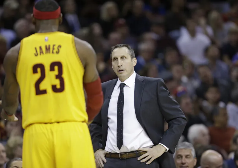 Cleveland Cavaliers head coach David Blatt, right, talks with Cleveland Cavaliers' LeBron James during an NBA basketball game against the San Antonio Spurs Wednesday, Nov. 19, 2014, in Cleveland. (AP Photo/Tony Dejak) ORG XMIT: OHTD10