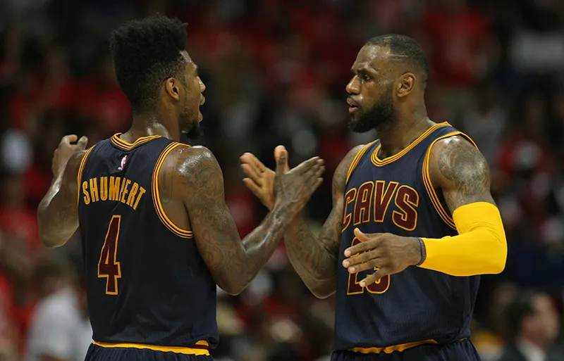 May 22, 2015; Atlanta, GA, USA; Cleveland Cavaliers forward LeBron James (23) reacts with guard Iman Shumpert (4) during the third quarter in game two of the Eastern Conference Finals of the NBA Playoffs against the Atlanta Hawks at Philips Arena. Mandatory Credit: Brett Davis-USA TODAY Sports