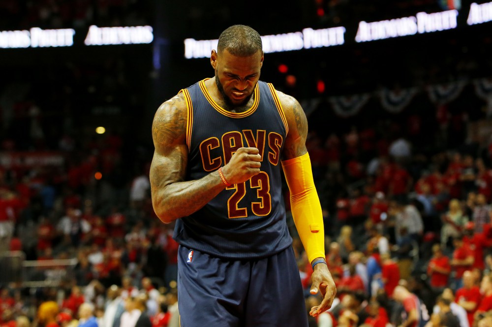 ATLANTA, GA - MAY 20:  LeBron James #23 of the Cleveland Cavaliers reacts in the final minutes of their 97 to 89 win over the Atlanta Hawks during Game One of the Eastern Conference Finals of the 2015 NBA Playoffs at Philips Arena on May 20, 2015 in Atlanta, Georgia. NOTE TO USER: User expressly acknowledges and agrees that, by downloading and or using this Photograph, user is consenting to the terms and conditions of the Getty Images License Agreement.  (Photo by Kevin C. Cox/Getty Images) ORG XMIT: 554941735 ORIG FILE ID: 474159826