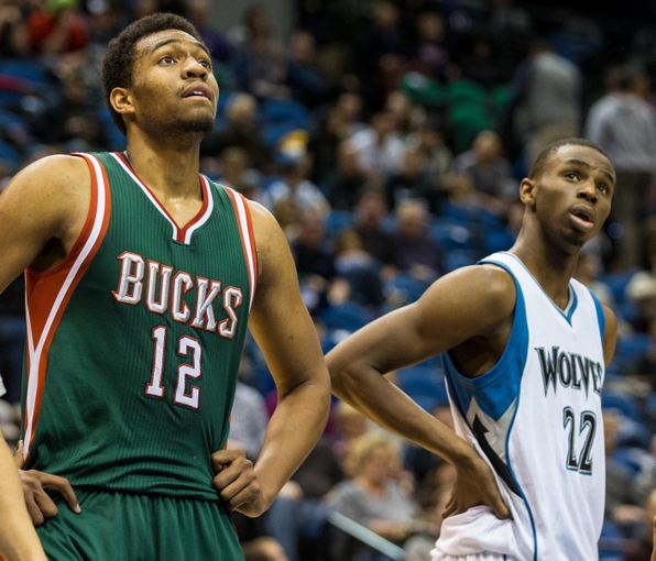 Nov 26, 2014; Minneapolis, MN, USA; Milwaukee Bucks forward Jabari Parker (12) and Minnesota Timberwolves guard Andrew Wiggins (22) look on during the fourth quarter at Target Center. The Bucks defeated the Timberwolves 103-86. Mandatory Credit: Brace Hemmelgarn-USA TODAY Sports